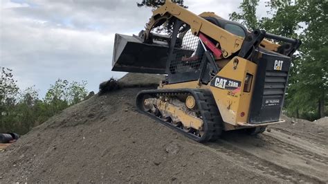 skid steer pushing dirt over cab|bobcat skid steer flip over.